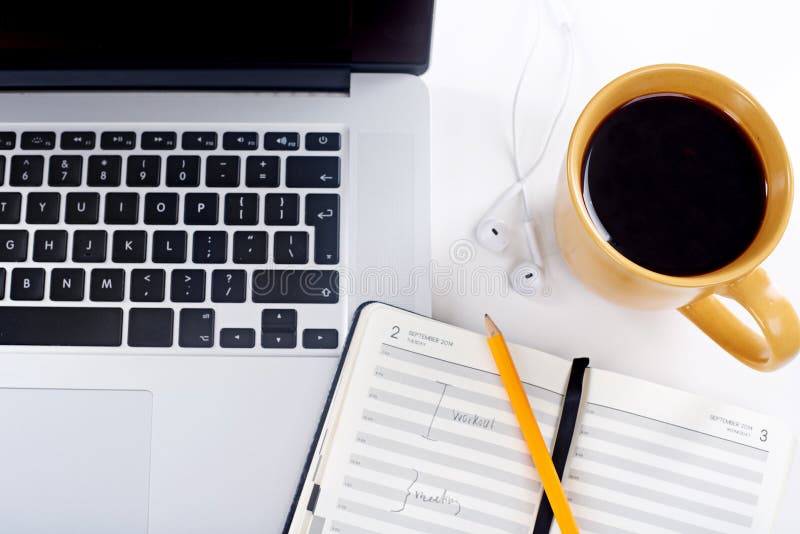 Closeup, laptop and coffee with notebook, keyboard and network with connection. Empty, computer and equipment with royalty free stock image