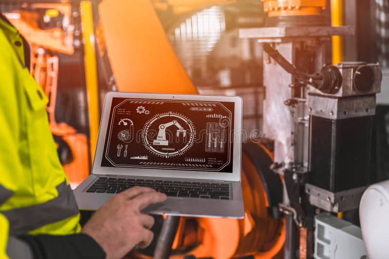 Closeup laptop computer screen display software program control operate industry robot arm machine in automation factory royalty free stock photo