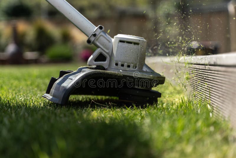 Closeup of a Lawn Mower Cutting the Green Grass Stock Photo Image of