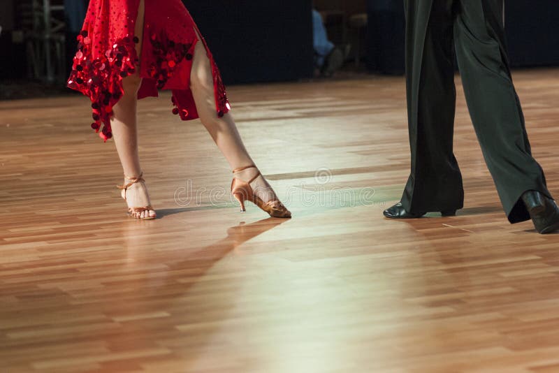Closeup of Legs of Two Professional Dancers Performing Latin -Am stock images