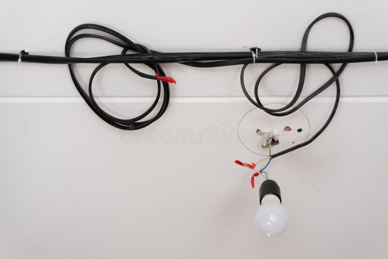 Closeup of Light Bulb Hanging on the Electric Wires Stock Photo Image