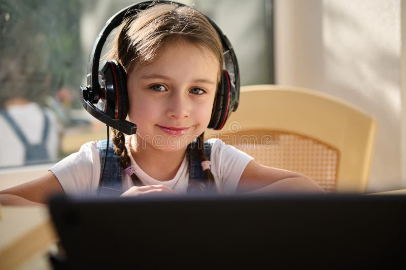 Closeup Little Girl First Grader in Audio Headset Sweetly Smiles ...