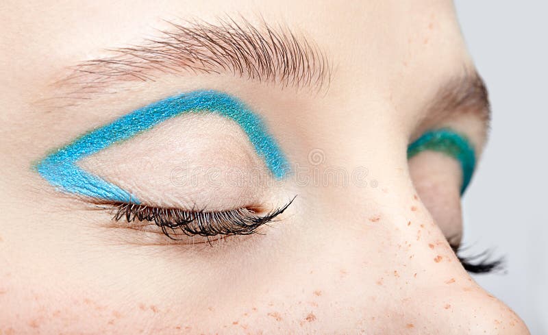 Closeup macro shot of closed human female eye and with blue smoky eyes shadow stock photos Closeup macro shot of closed human female eye and with blue smoky eyes shadow stock photos