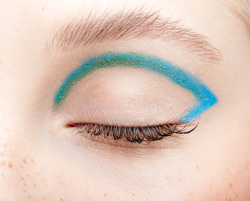 Closeup macro shot of closed human female eye and with blue smoky eyes shadow royalty free stock photos Closeup macro shot of closed human female eye and with blue smoky eyes shadow royalty free stock photos