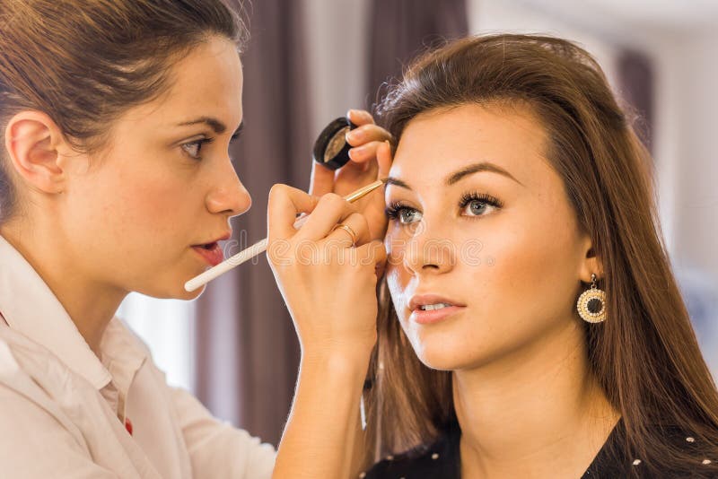 Closeup of a Makeup Artist at Work Stock Photo Image of model
