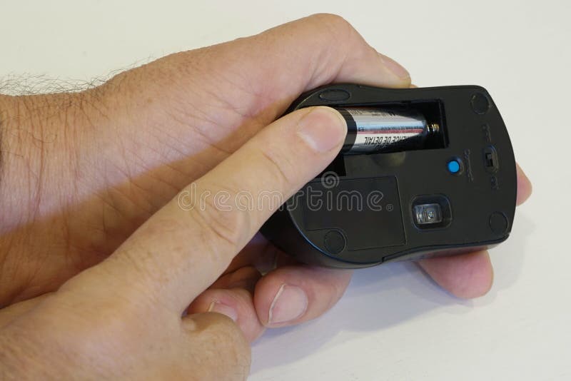 Closeup of Man Putting AA Battery in Wireless Mouse Stock Image Image