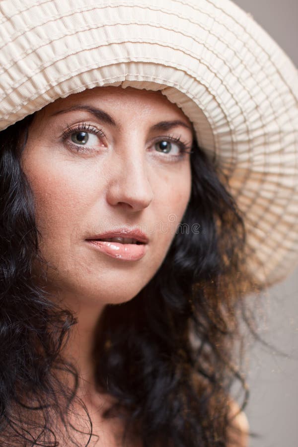 Closeup of mature woman in a hat