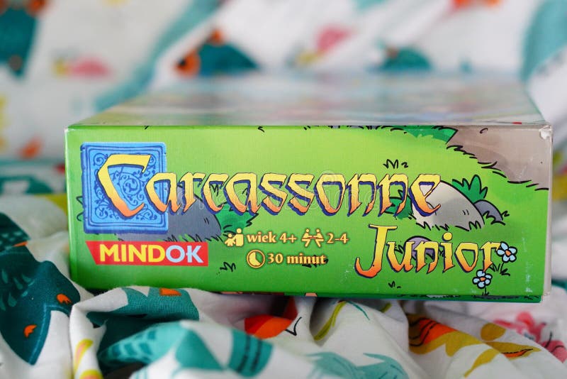 Closeup of a Mindok brand Carcassonne Junior game isolated on a bed sheet royalty free stock photo