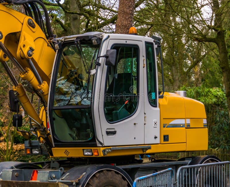 Closeup of a modern excavator machine, New equipment and technology, Earthmoving industry background stock photos Closeup of a modern excavator machine, New equipment and technology, Earthmoving industry background stock photos