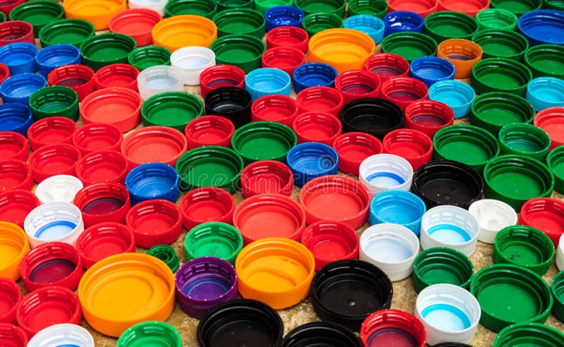 Closeup of multi-colored plastic lids stock photo