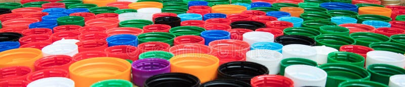 Closeup of multi-colored plastic lids stock photography