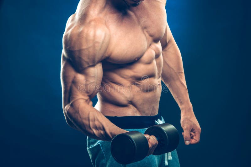Closeup of a muscular young man lifting dumbbells stock photography Closeup of a muscular young man lifting dumbbells stock photography