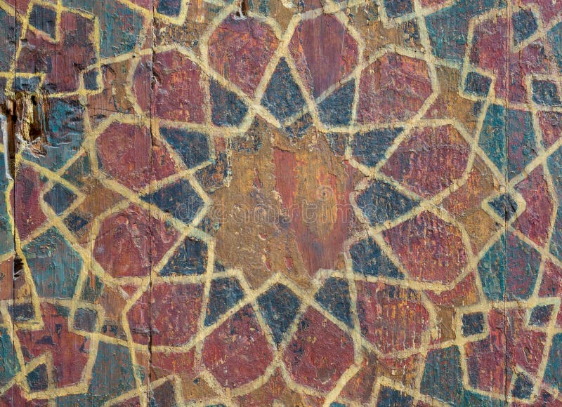 Closeup of ornaments of a wooden cupboard painted with colored geometrical patterns stock photo Closeup of ornaments of a wooden cupboard painted with colored geometrical patterns stock photo