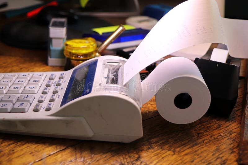 Closeup of the paper roll on a calculator adding machine stock image
