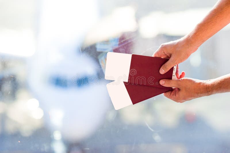 Closeup passports and boarding pass at airport