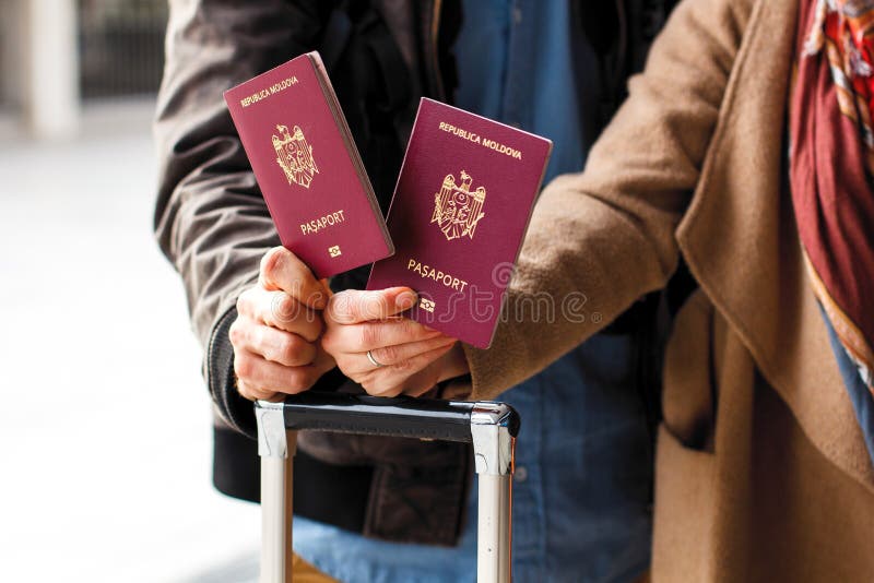 Closeup of passports on the luggage. Travel or emigration concept. Biometric passport of Moldova