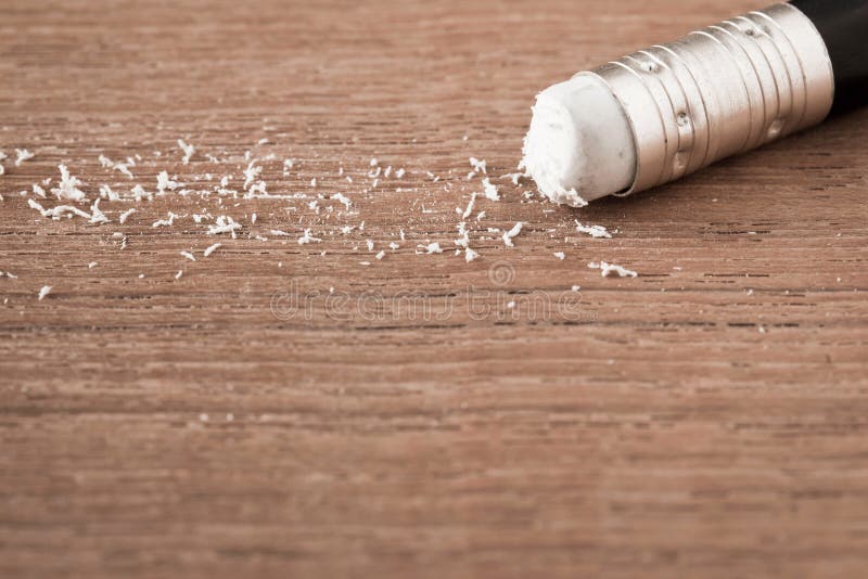 Closeup pencil eraser on wooden table, soft focus royalty free stock photo