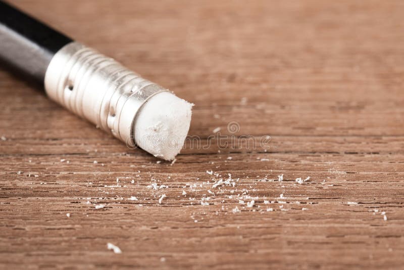 Closeup pencil eraser on wooden table, soft focus stock image