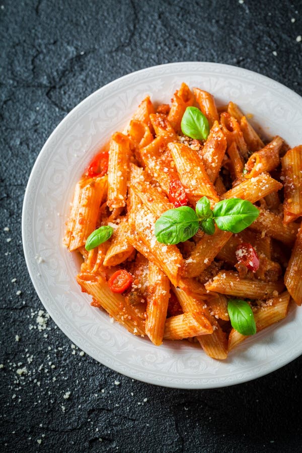 Closeup of Penne Bolognese with Parmesan and Basil Stock Image - Image ...