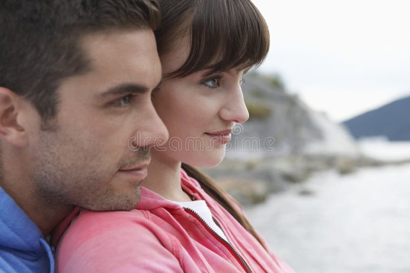 Closeup Of Pensive Couple At Beach