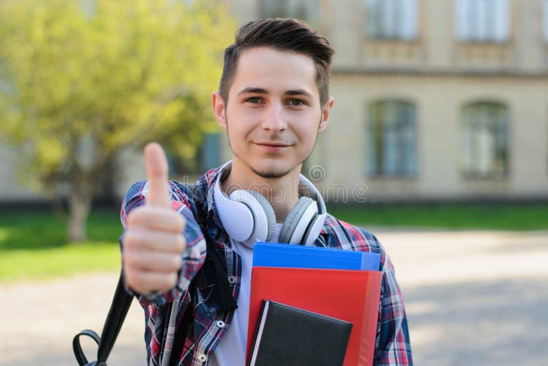 Closeup photo of excited clever intelligent guy demonstrating finger up symbol to you royalty free stock photography Closeup photo of excited clever intelligent guy demonstrating finger up symbol to you royalty free stock photography