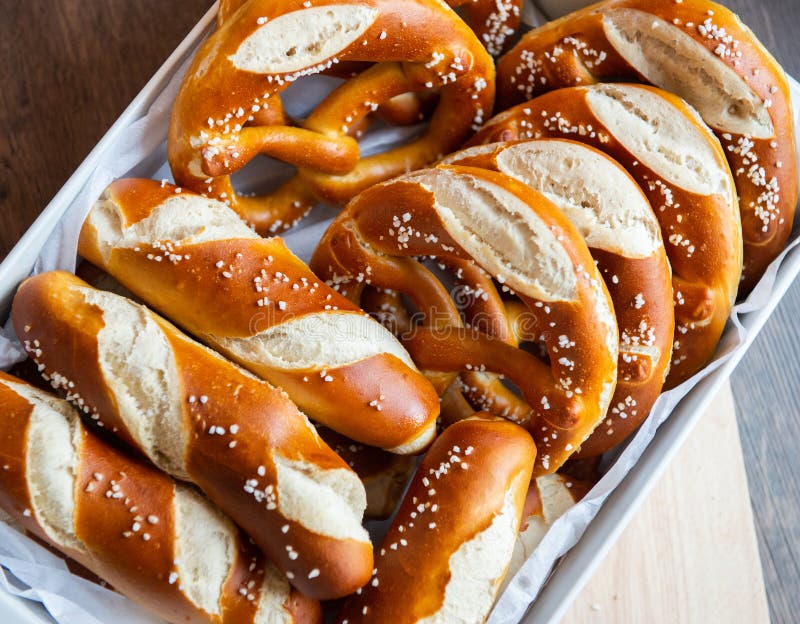 Closeup Photo of Lye Bun and Bavarian Pretzel in Bakery Stock Photo