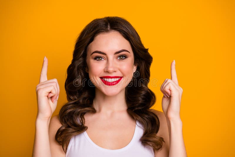 Closeup Photo of Pretty Curly Lady Directing Fingers Up Empty Space ...