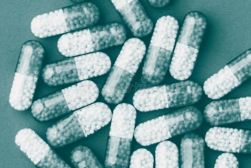 Closeup of a pile of green pharmaceutical capsules stock image Closeup of a pile of green pharmaceutical capsules stock image