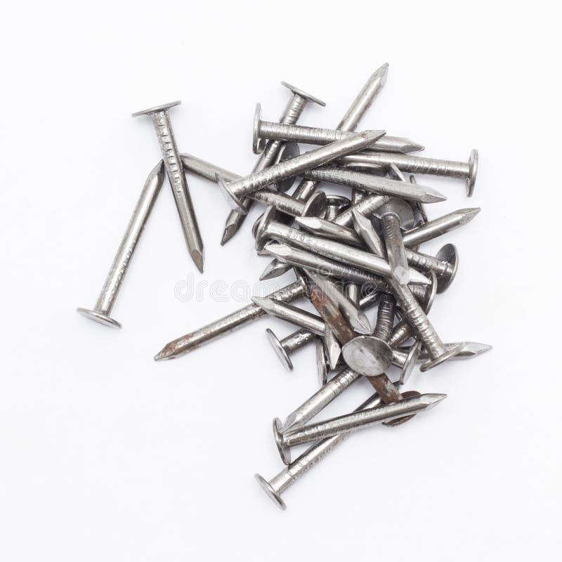 Closeup of a pile of rivets, nails isolated on white background stock photography Closeup of a pile of rivets, nails isolated on white background stock photography