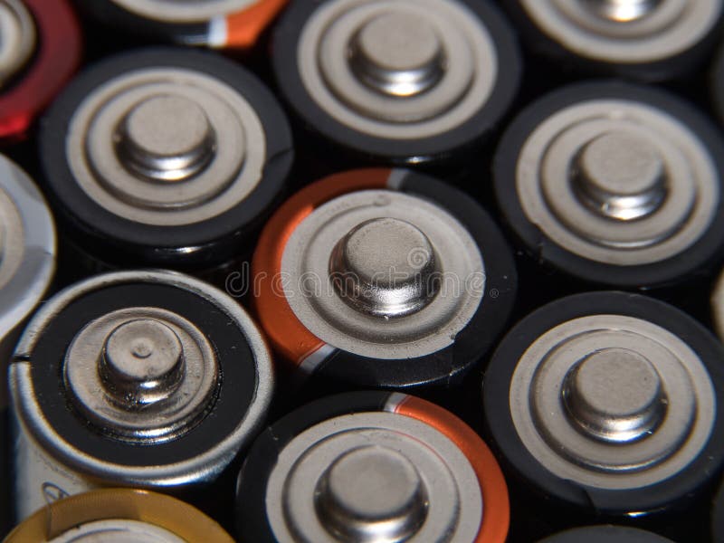 Closeup of Pile of Used Alkaline Batteries. Close Up Colorful Rows of