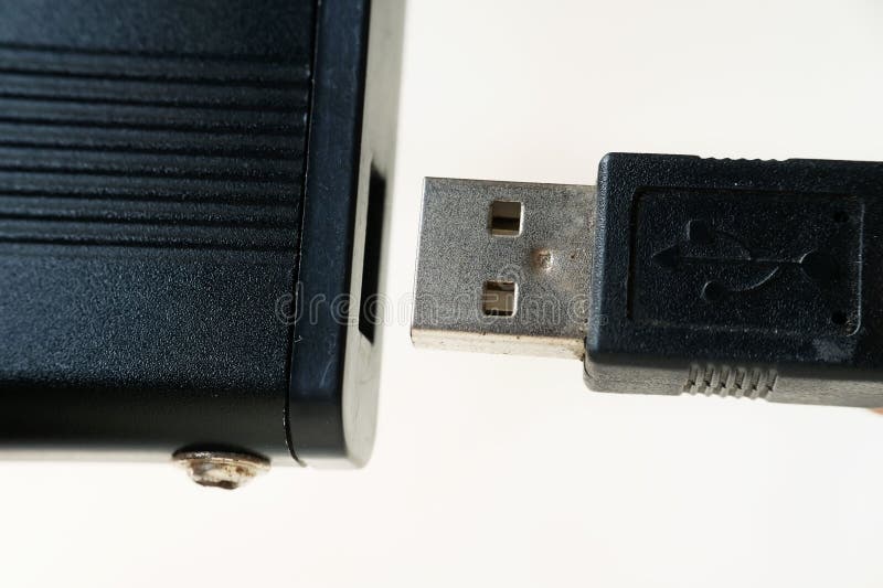 Closeup of Plugging the USB Cable into the Data Storage Port Stock