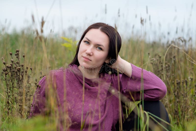 Closeup portrait of attractive brunette female on autumn floral field. stock images Closeup portrait of attractive brunette female on autumn floral field. stock images