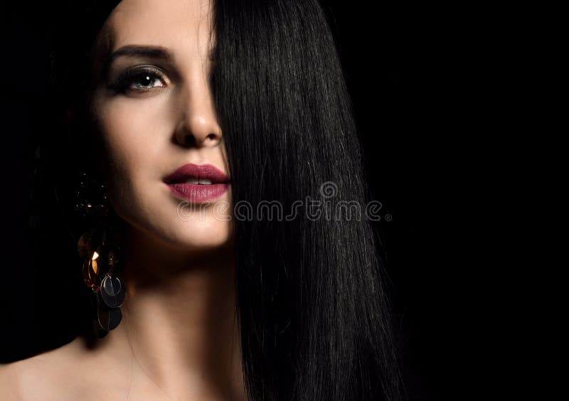 Closeup portrait of beautiful brunette girl with healthy long hair on black royalty free stock photo Closeup portrait of beautiful brunette girl with healthy long hair on black royalty free stock photo