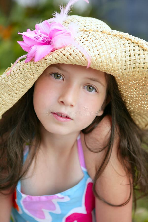 Closeup portrait of beautiful teen little girl with hat in the park. Closeup portrait of beautiful teen little girl with hat in the park