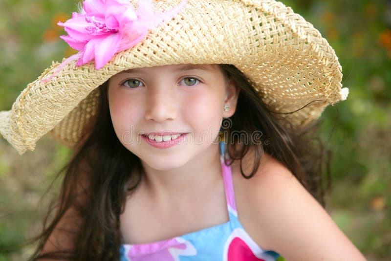 Closeup portrait of beautiful teen little girl with hat in the park. Closeup portrait of beautiful teen little girl with hat in the park