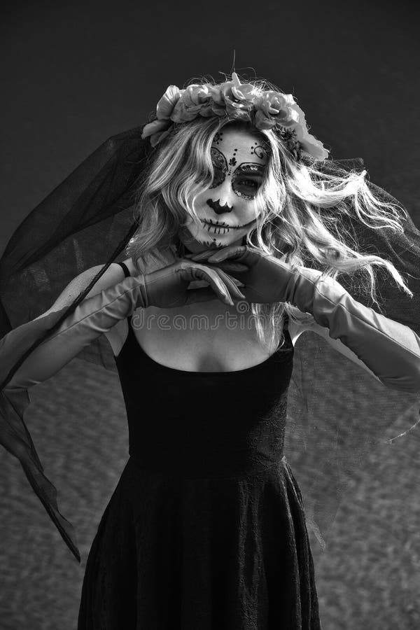 Young Woman with Calavera Makeup (sugar Skull) Piercing Voodoo Doll ...
