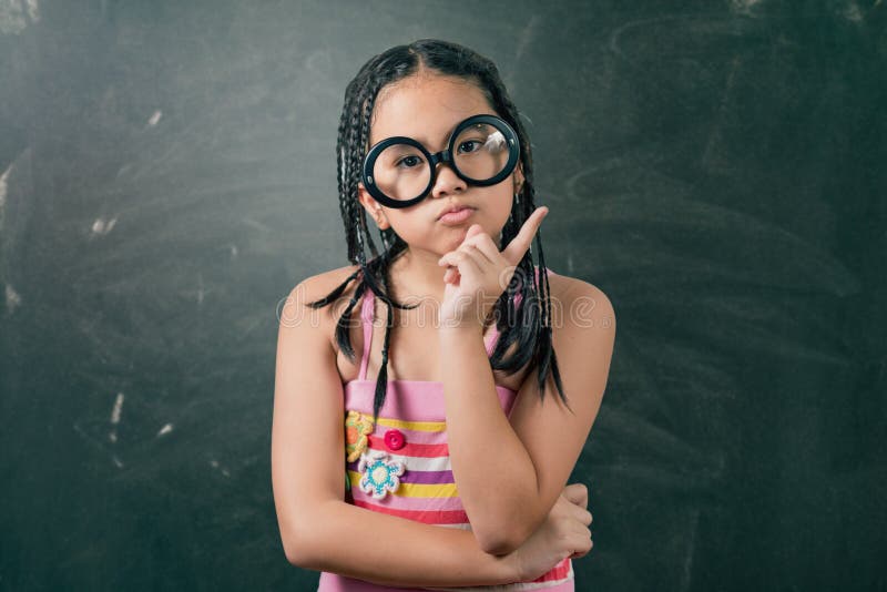 Closeup portrait of Cute little girl thinking stock photos Closeup portrait of Cute little girl thinking stock photos