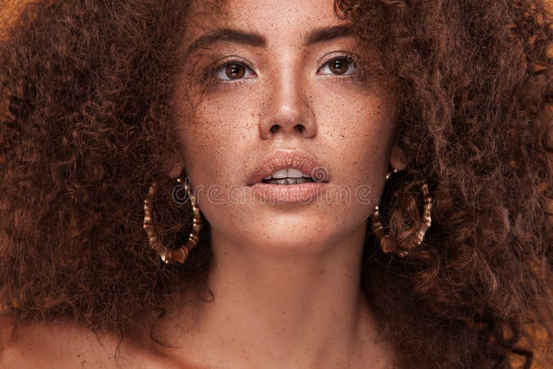 Closeup portrait of girl with afro hairstyle. Studio shot. stock photo Closeup portrait of girl with afro hairstyle. Studio shot. stock photo