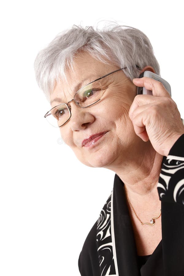 Closeup portrait of active older woman using mobile phone, isolated on white. Closeup portrait of active older woman using mobile phone, isolated on white.