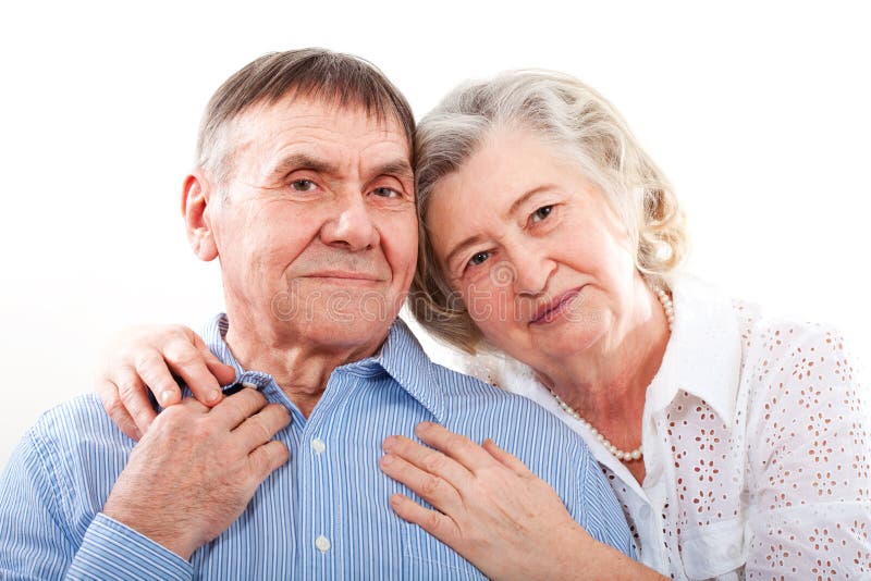 Closeup portrait of smiling elderly couple