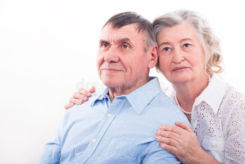 Closeup portrait of smiling elderly couple