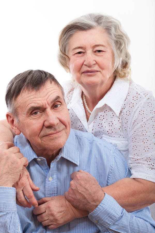 Closeup portrait of smiling elderly couple