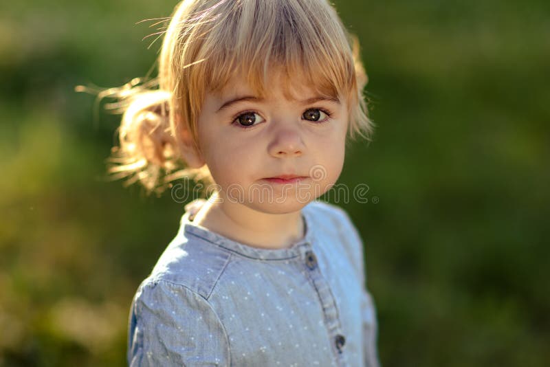 Closeup Portrait Tiny Blonde Girl in Blue Jeans Dress, Smiling and ...