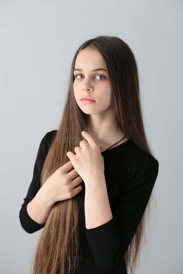 Closeup Portrait on a White Background of a European Girl with Long Dark  Hair in a Black Dress Stock Image - Image of long, girl: 171003313