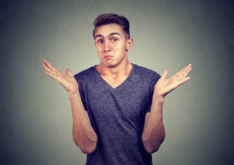Closeup portrait young man shrugging shoulders. Body language stock photography Closeup portrait young man shrugging shoulders. Body language stock photography