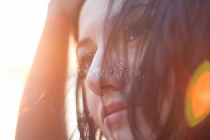 Closeup portrait of young woman in bright light of sunset. Summer royalty free stock images Closeup portrait of young woman in bright light of sunset. Summer royalty free stock images