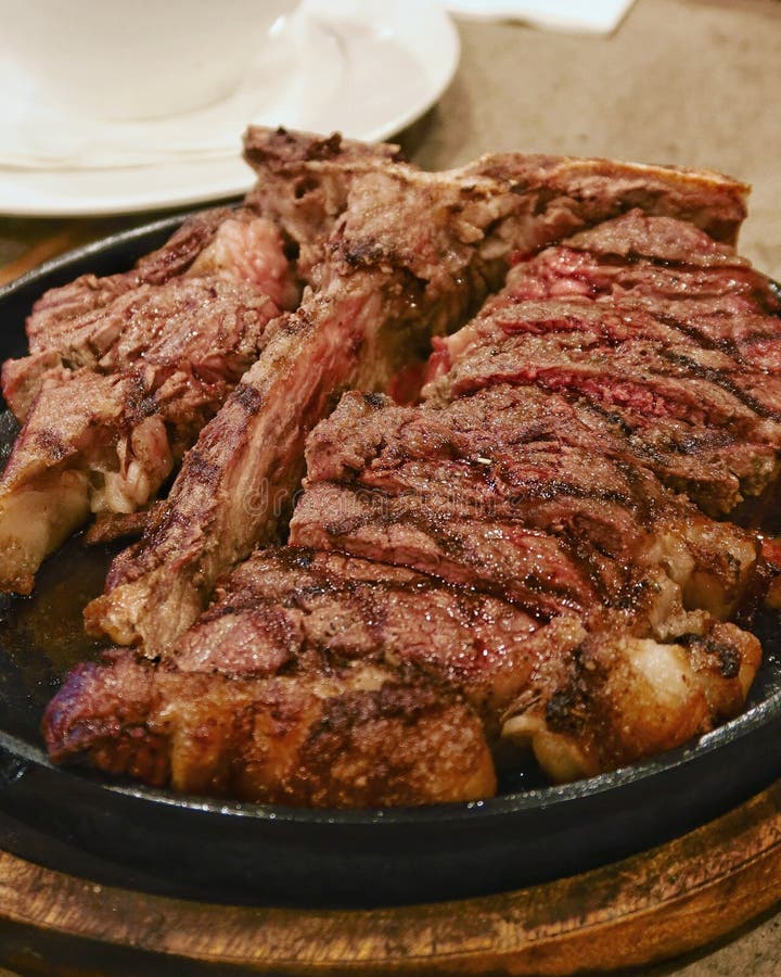 Steak on a hot plate stock image. Image of onions, dinner 13219739