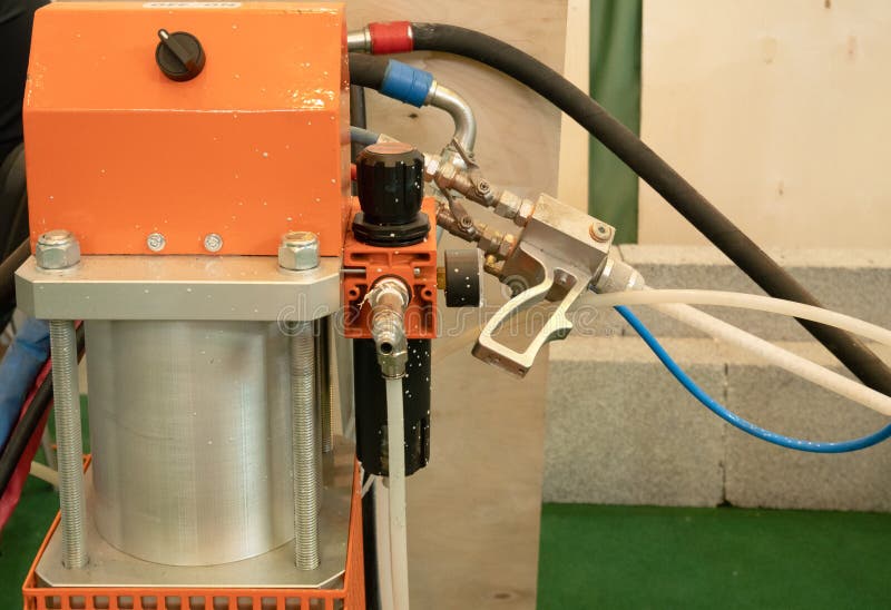 Closeup professional automatic spraying machine system pneumatic equipment for painting cars, houses and different surfaces or royalty free stock images Closeup professional automatic spraying machine system pneumatic equipment for painting cars, houses and different surfaces or royalty free stock images