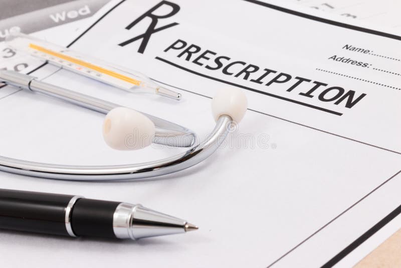 Closeup Of Red Stethoscope, Thermometer And Pen On A Rx Prescription.