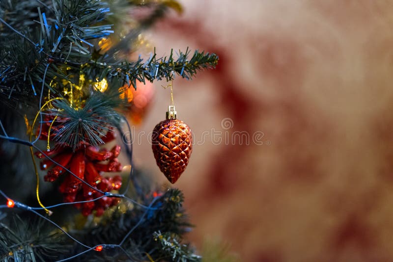 Closeup of a red toy hanging on a decorated Christmas tree stock photography